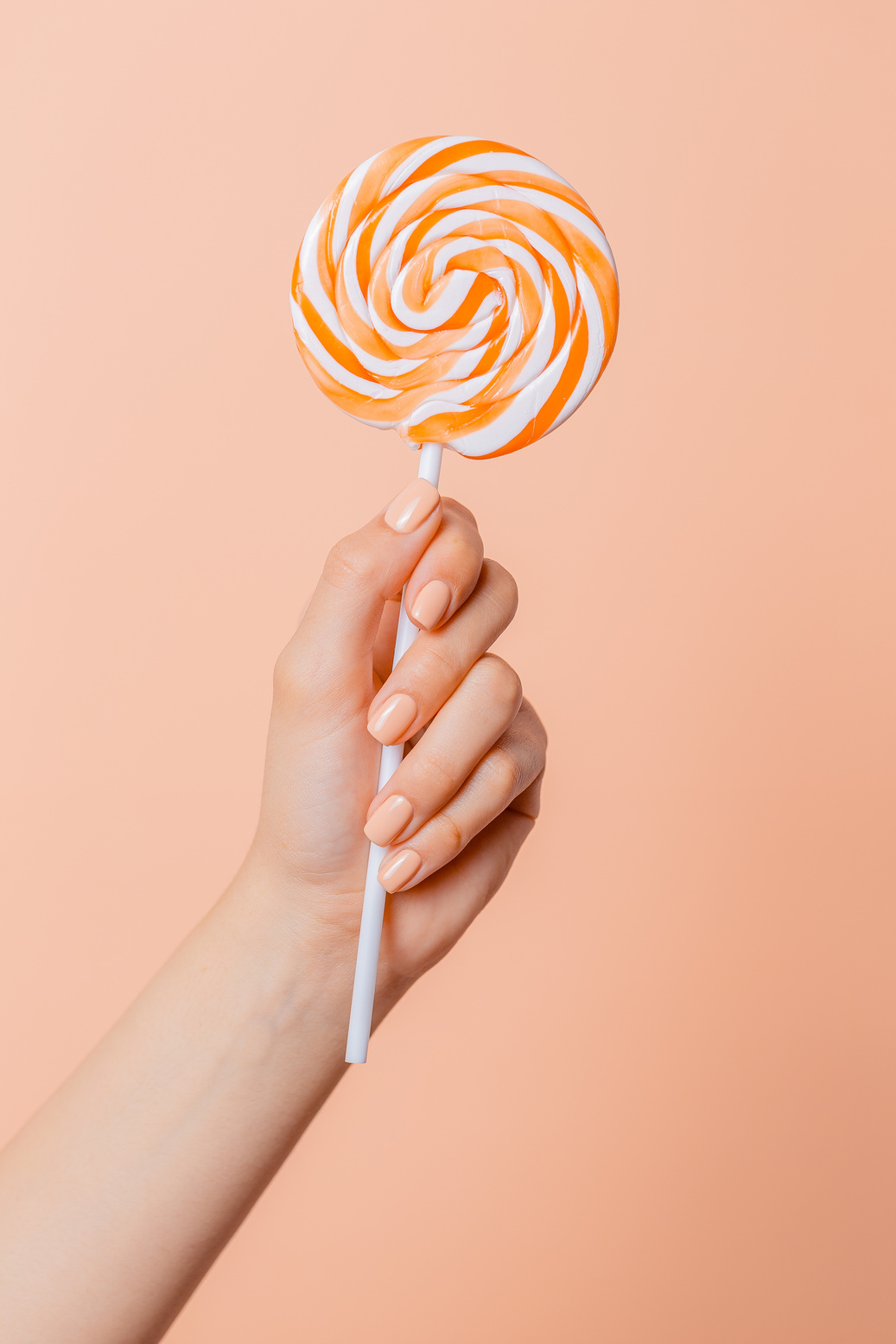 Hand Holding a Lollipop